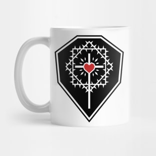 The cross of Jesus Christ with a heart framed by a crown of thorns against the background of a shield. Mug